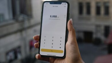 a person holding a cell phone in their hand