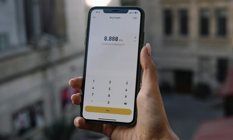 a person holding a cell phone in their hand