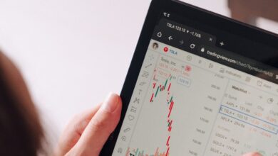 a woman holding a tablet with a chart on it