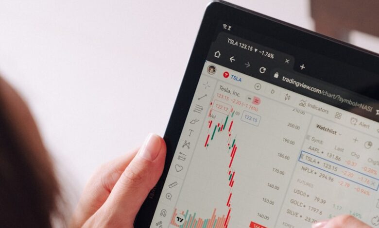 a woman holding a tablet with a chart on it