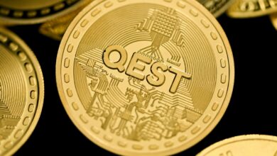 a close up of a pile of gold coins
