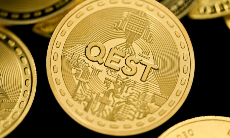 a close up of a pile of gold coins