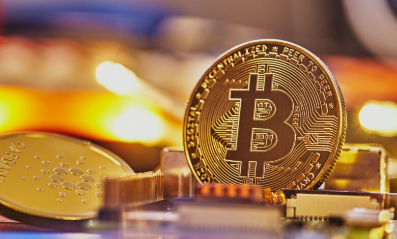 a bit coin sitting on top of a pile of coins