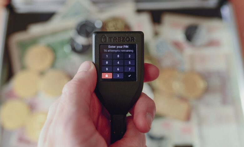 a person holding a cell phone in their hand