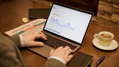 a person typing on a laptop on a table