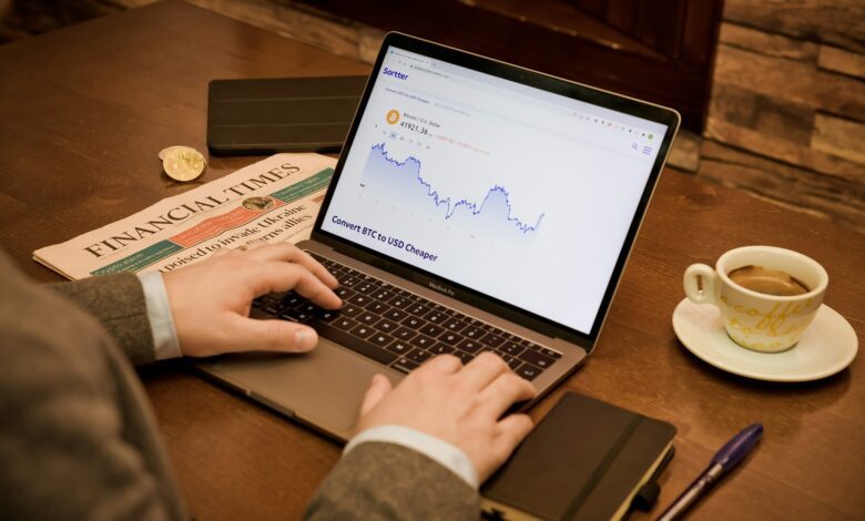 a person typing on a laptop on a table