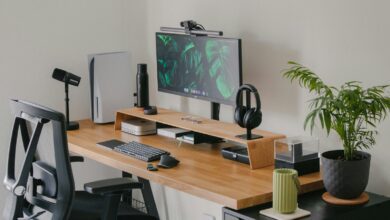 a computer desk with a monitor and keyboard