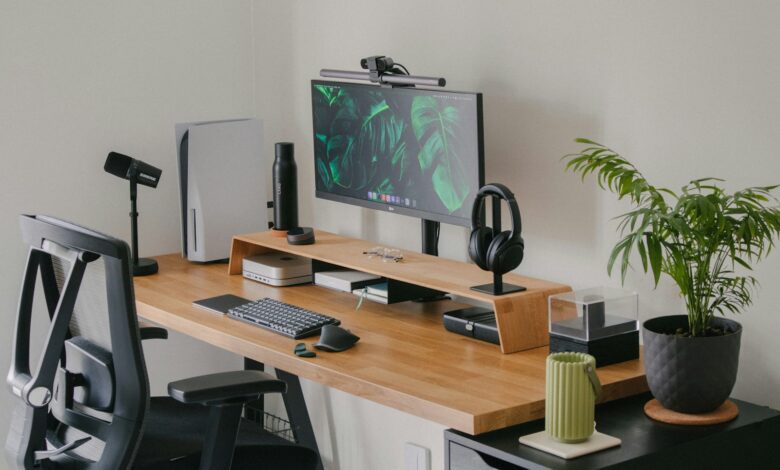 a computer desk with a monitor and keyboard