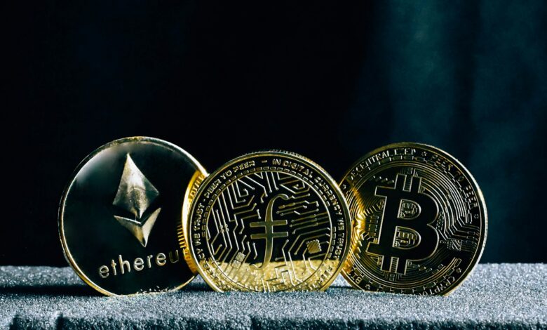 three bitcoins sitting on top of a table