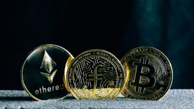 three bitcoins sitting on top of a table